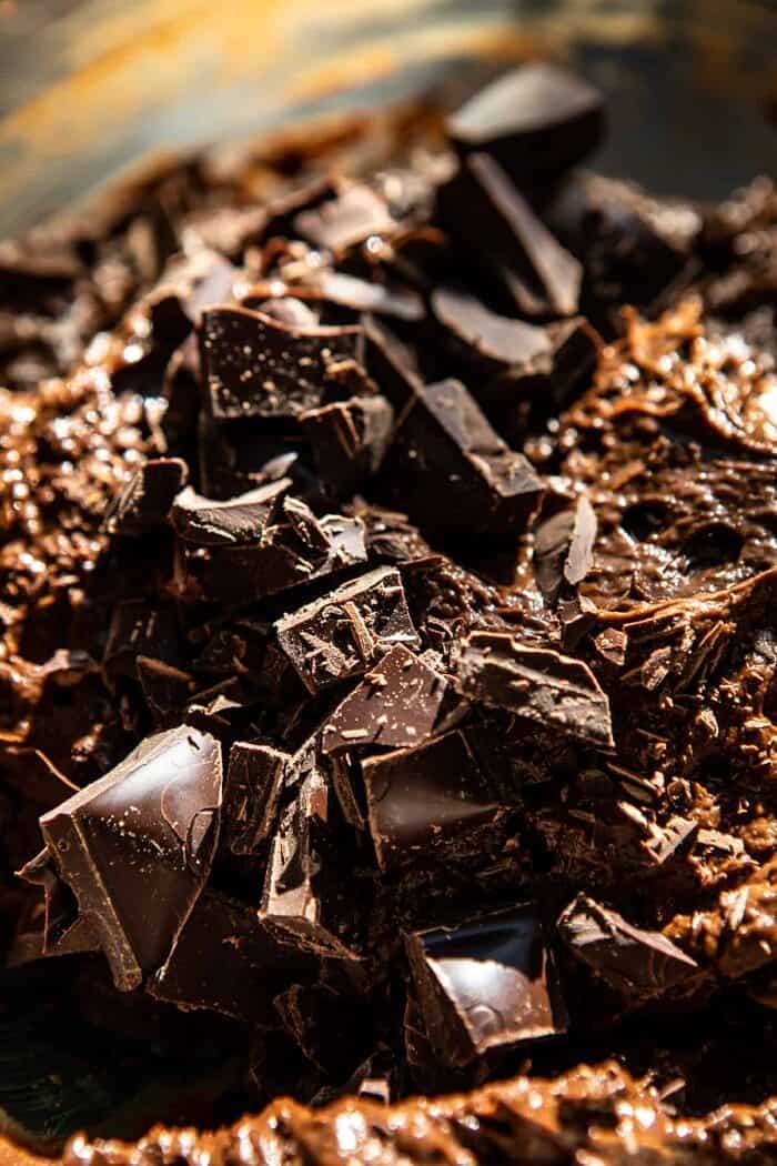 brownie batter in mixing bowl with chocolate chunks