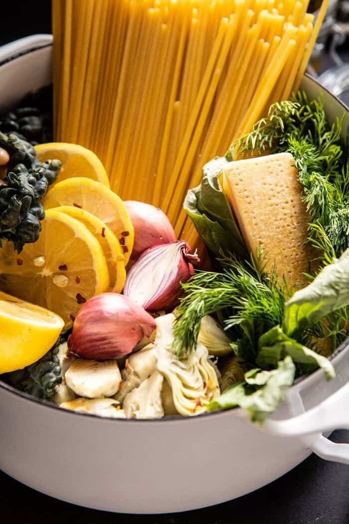 side angled photo of One Pot Creamy Tuscan Pesto and Artichoke Pasta before cooking