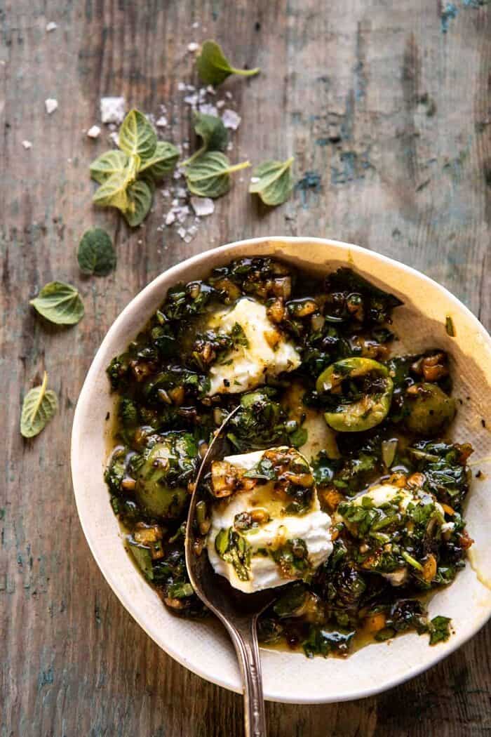 Lemon Olive Dressing in bowl with goat cheese