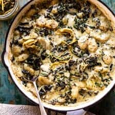 Skillet Baked Creamy Pesto Spinach and Artichoke Gnocchi | halfbakedharvest.com #gnocchi #easyrecipes #oneskillet