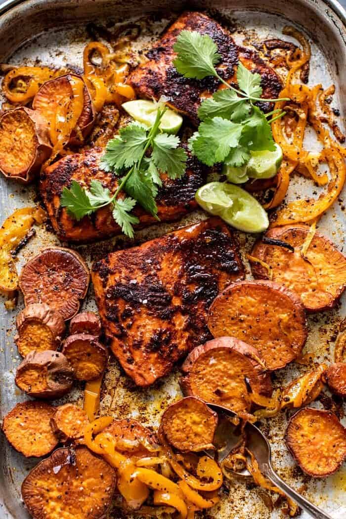 overhead photo of Sheet Pan Chipotle Salmon with sweet potatoes and bell peppers