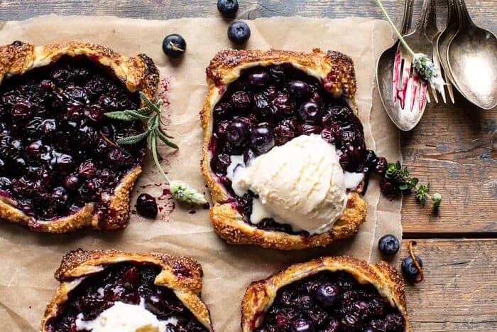 overhead horizontal photo of Bursting Blueberry Lemon Thyme Tarts 