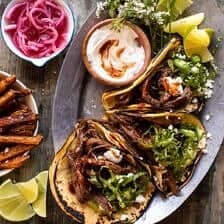 Crockpot Carne Asada Tacos with Cilantro Lime Garlic Sauce | halfbakedharvest.com