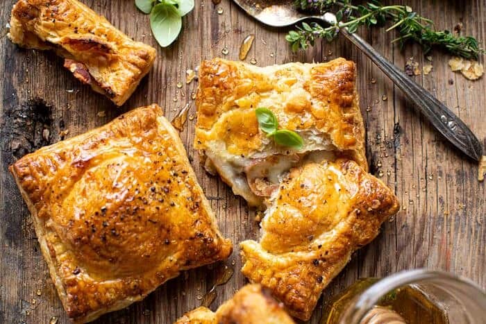 overhead horizontal photo of Prosciutto Caprese Puff Pastries with Peppery Thyme Honey