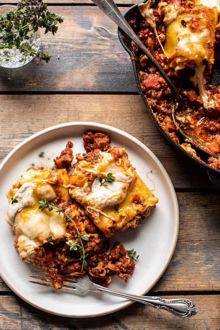 overhead photo of Simple Skillet Pesto Cheese Lasagna Roll Ups on a plate with fork