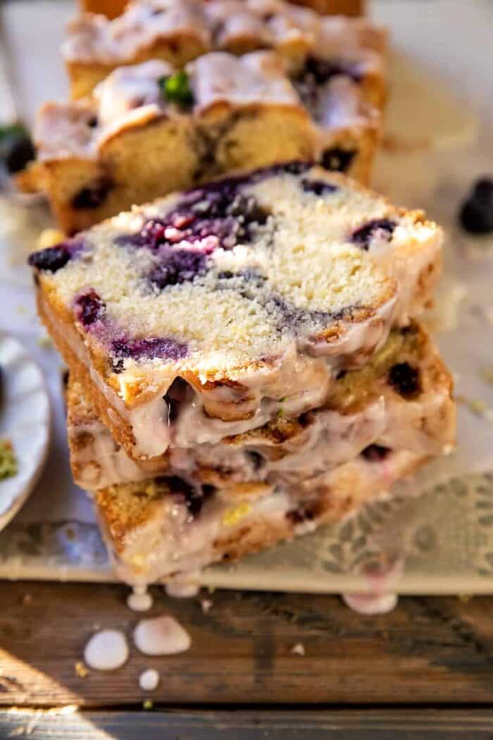 sided angled close up photo of Blueberry Lemon Thyme Cake | halfbakedharvest.com