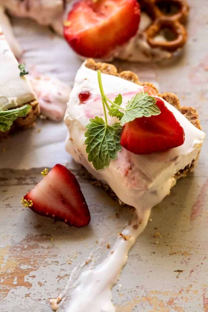overhead photo of Double Strawberry Pretzel Pie slice with bite taken out of slice