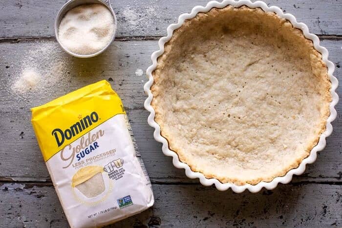 overhead horizontal photo of Lemon Sugar Coconut Cream Pie shell before adding the coconut filling 