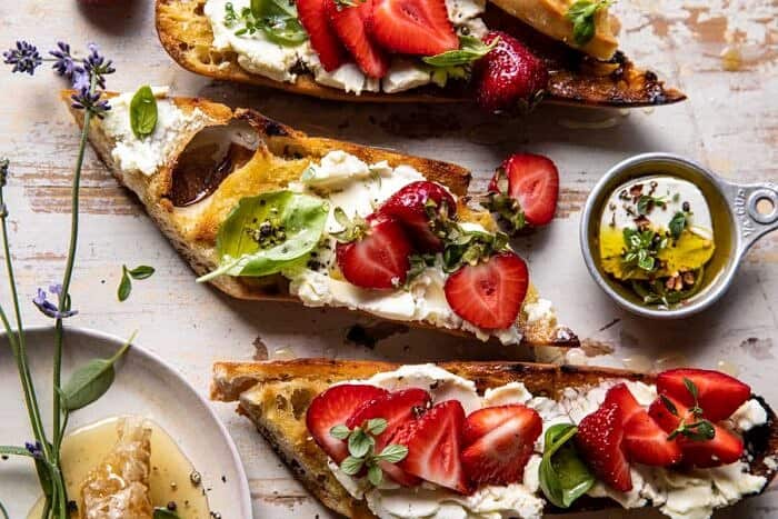 overhead horizontal photo of Marinated Goat Cheese Strawberry Crostini 
