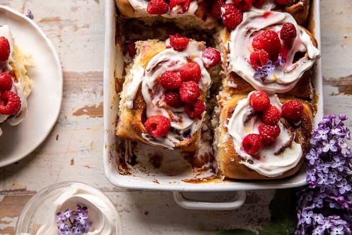 overhead close up horizontal photo of Raspberry Lemon Brioche Rolls with Whipped Ricotta Cream