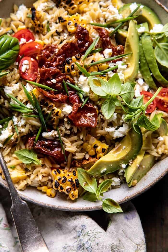 overhead close up photo of Brown Butter Corn and Feta Orzo with Crispy Prosciutto
