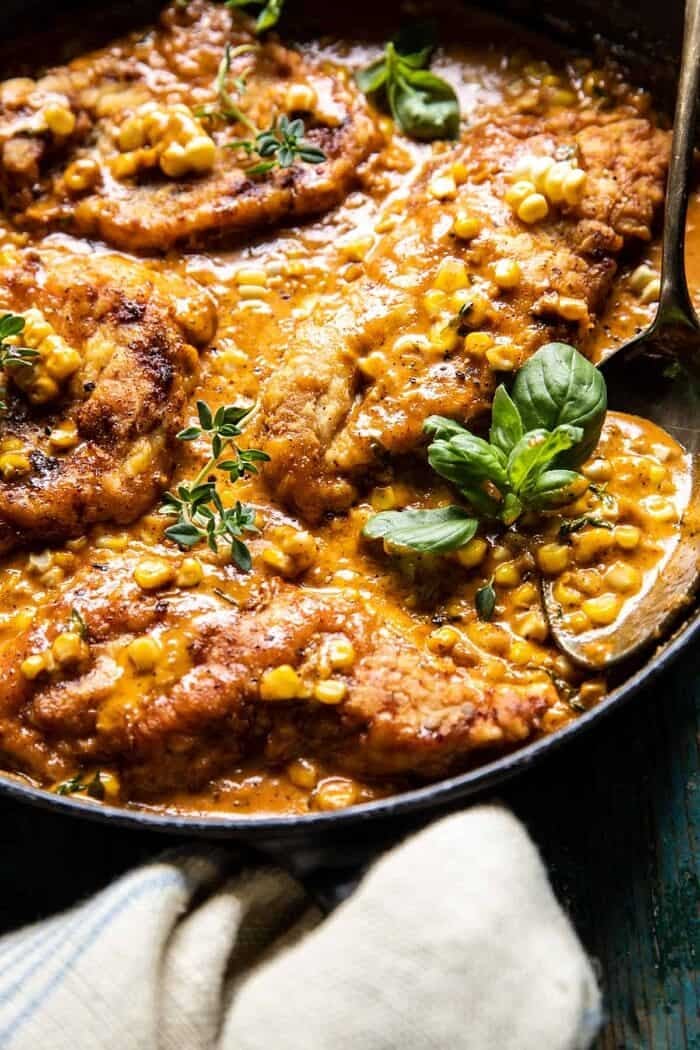 side angle photo of Creamy Cajun Skillet Chicken Lazone with Herby Corn 