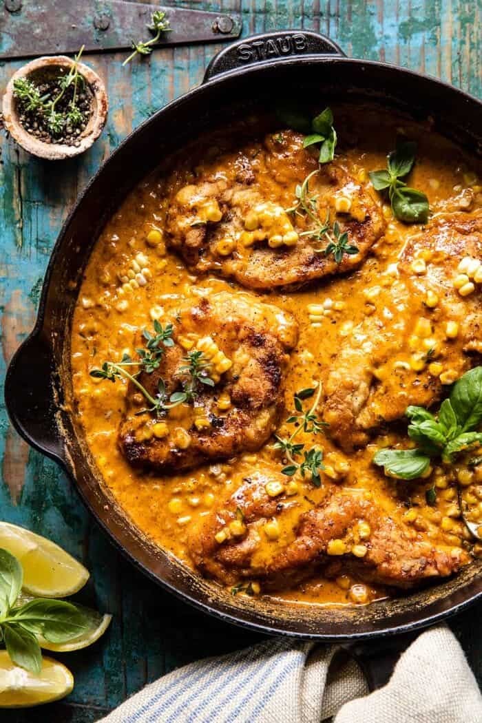 overhead photo of Skillet Creamy Cajun Chicken Lazone with Herby Corn | halfbakedharvest.com