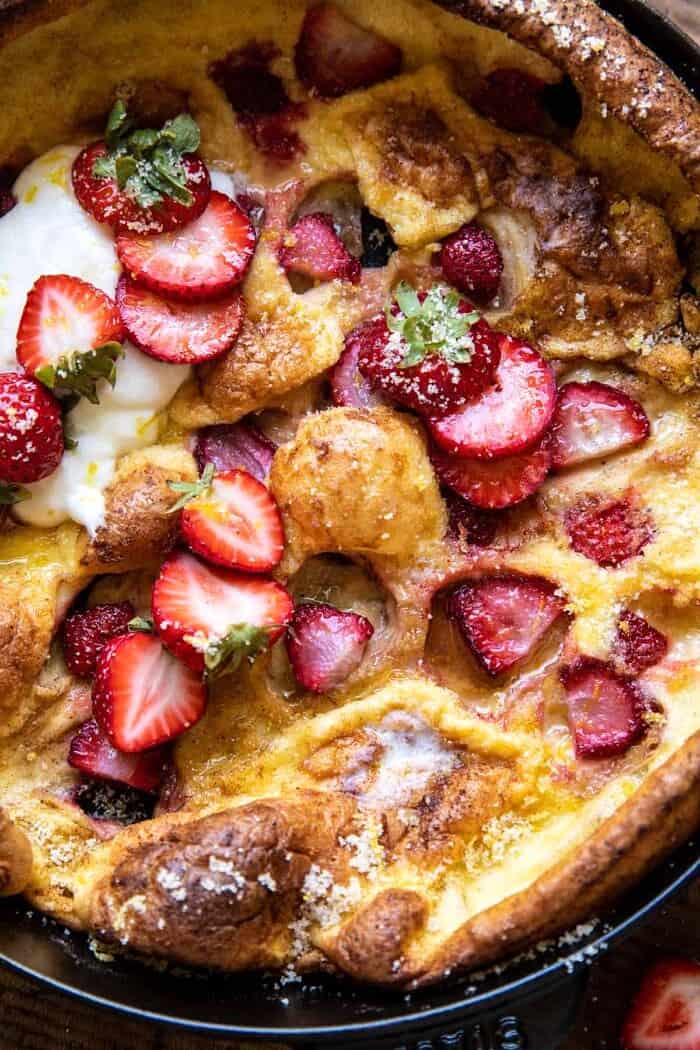 overhead close up photo of Lemon Strawberry Dutch Baby with Ricotta Cream 