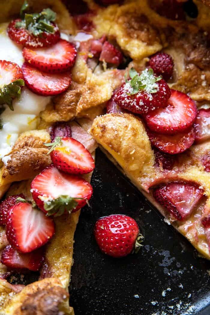 overhead close up photo of Lemon Strawberry Dutch Baby with Ricotta Cream