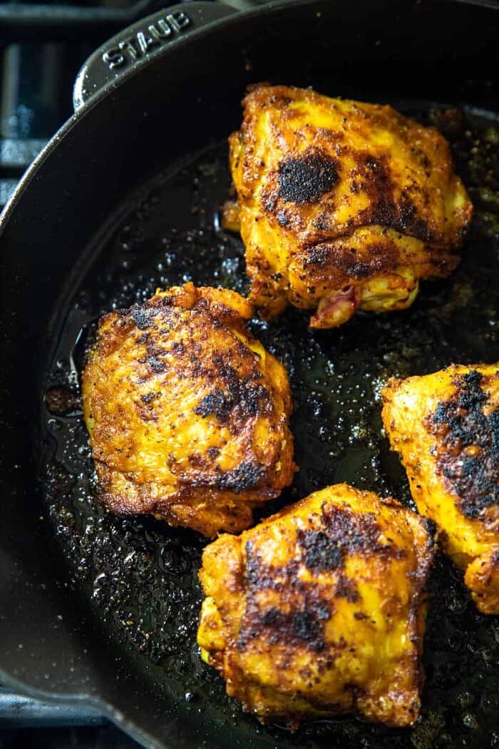 chicken cooking in skillet