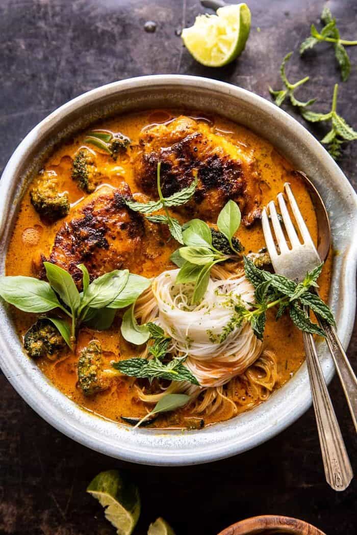 overhead close up photo of Saucy Coconut Braised Chicken with Rice Noodles and Broccoli 