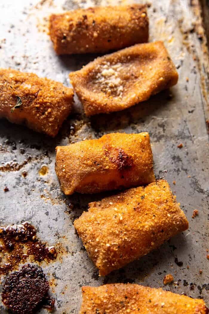 overhead photo of Homemade Cheesy Pizza Rolls on baking sheet after baking
