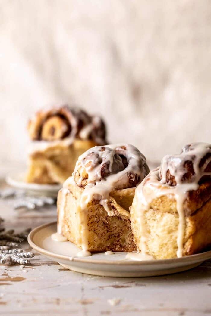 Easy Fluffy Eggnog Cinnamon Rolls on serving plates