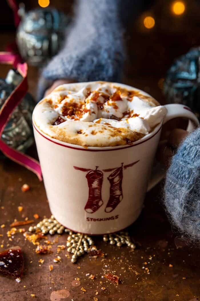 Salted Caramel Brulee Latte with hands on mug