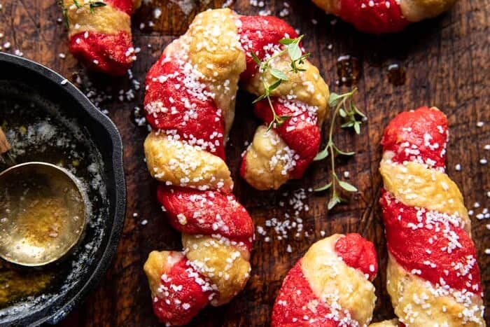 overhead horizontal photo of Salted Garlic Butter Candy Cane Bagels 