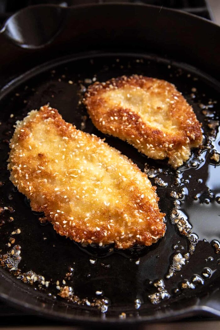 Chicken Katsu cooking in skillet 