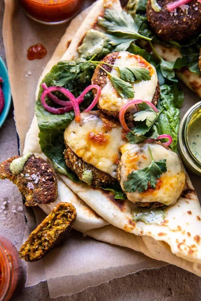 overhead close up photo of Crispy Sesame Falafel Melts with Garlicky Green Tahini