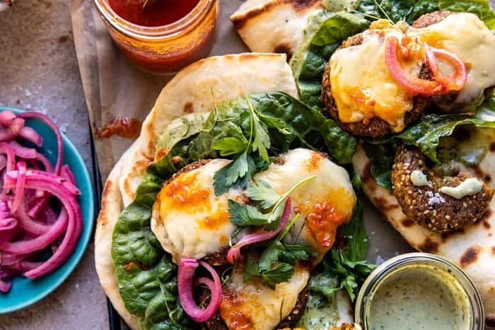 overhead horizontal photo of Crispy Sesame Falafel Melts with Garlicky Green Tahini 