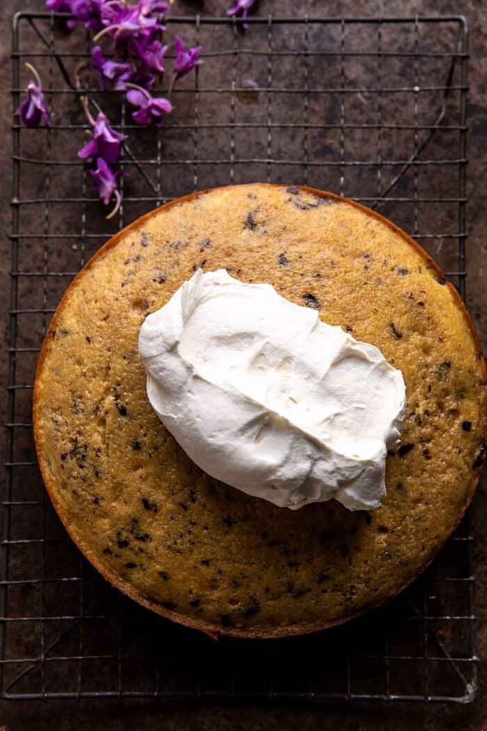 prep photo of Vanilla Tiramisu Cake after baking with a dollop of frosting on top