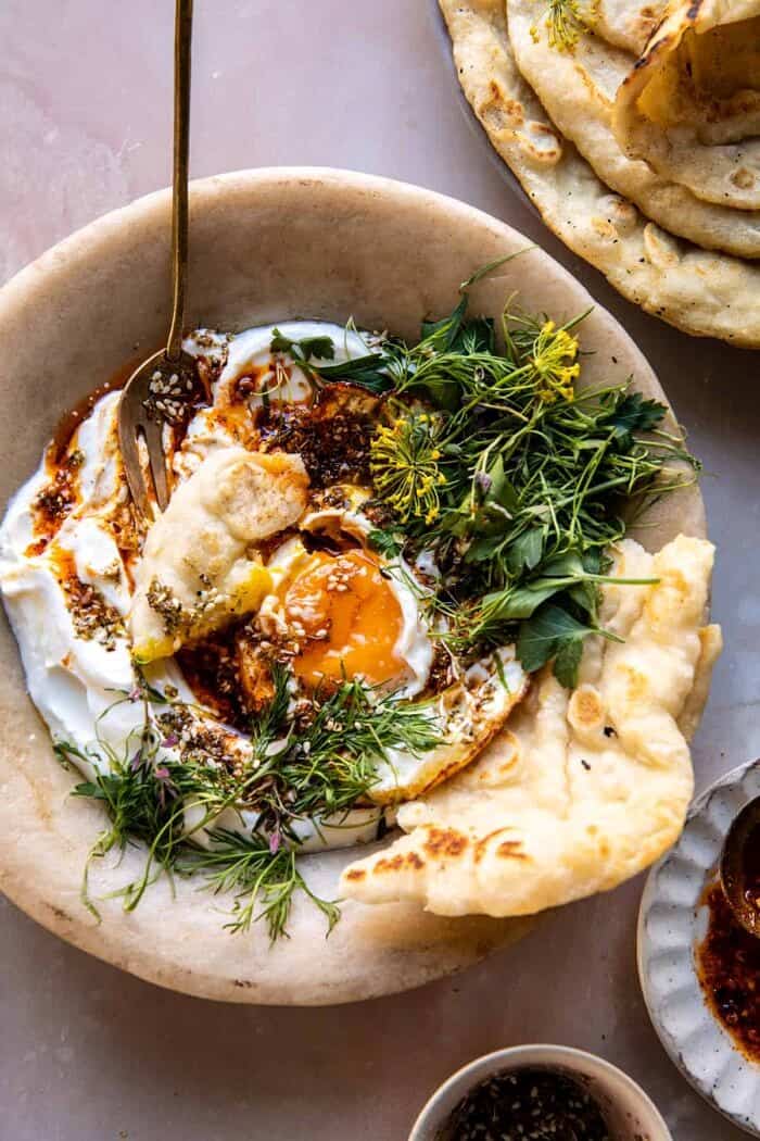 overhead photo of Za’atar Eggs with Lemony Yogurt and Herbs 