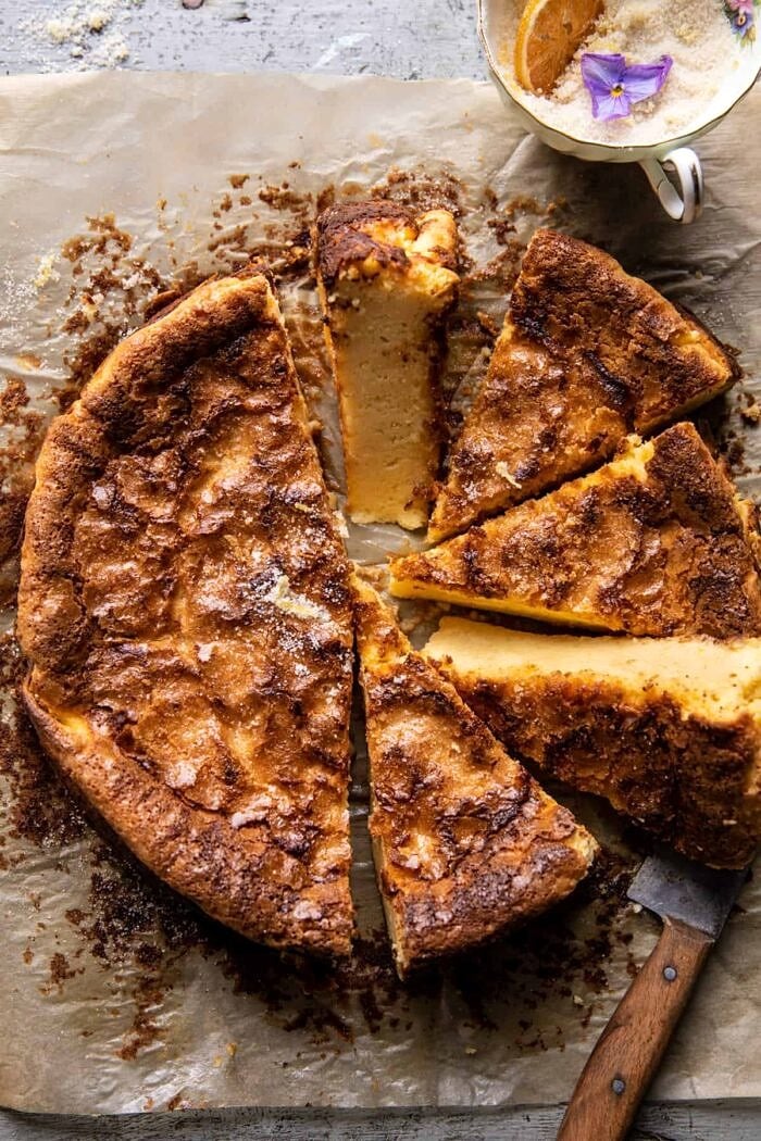 overhead photo of Simple Lemon Sugar Burnt Basque Cheesecake with a few slices of cake cut