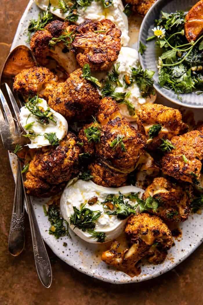 overhead close up photo of Crispy Roasted Blackened Cauliflower with Burrata and Herbs