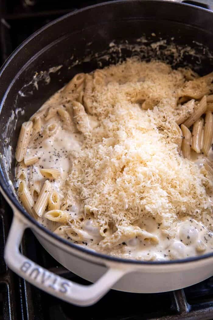 One Pot Creamy Penne Alfredo with Spicy Arugula | halfbakedharvest.com