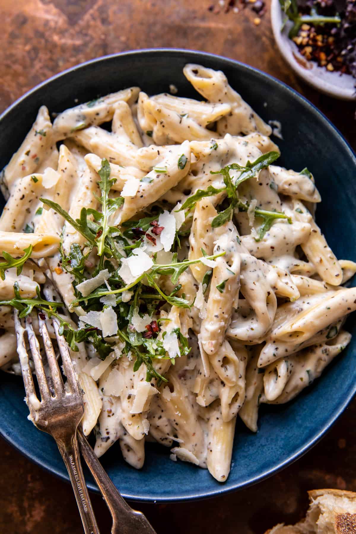 One Pot Creamy Penne Alfredo with Spicy Arugula | halfbakedharvest.com