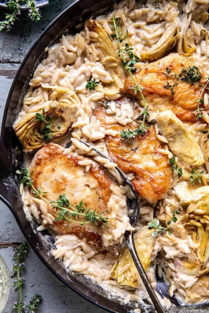 overhead close up photo of One Skillet Creamy Artichoke Chicken Marsala and Orzo