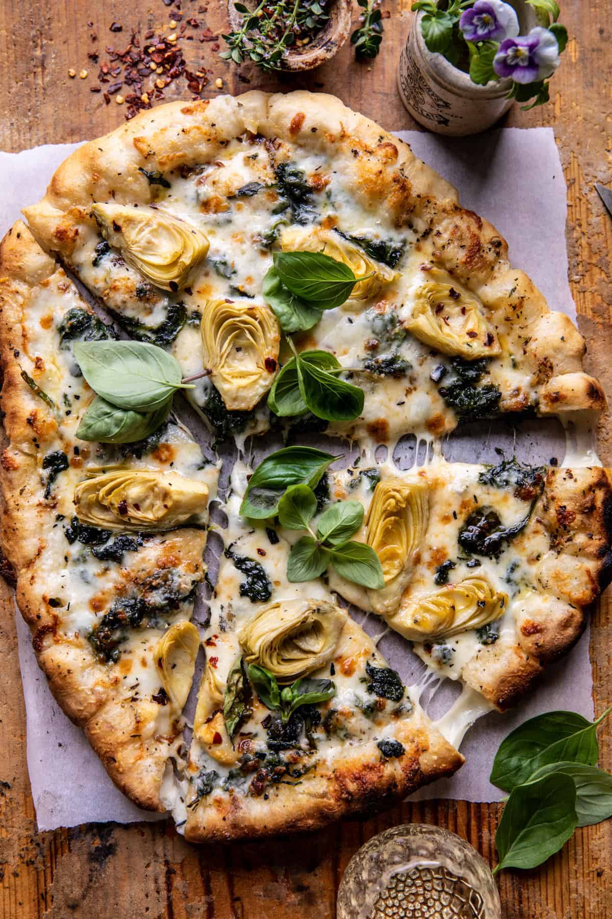 Spinach and Artichoke Pizza with Cheesy Bread Crust | halfbakedharvest.com