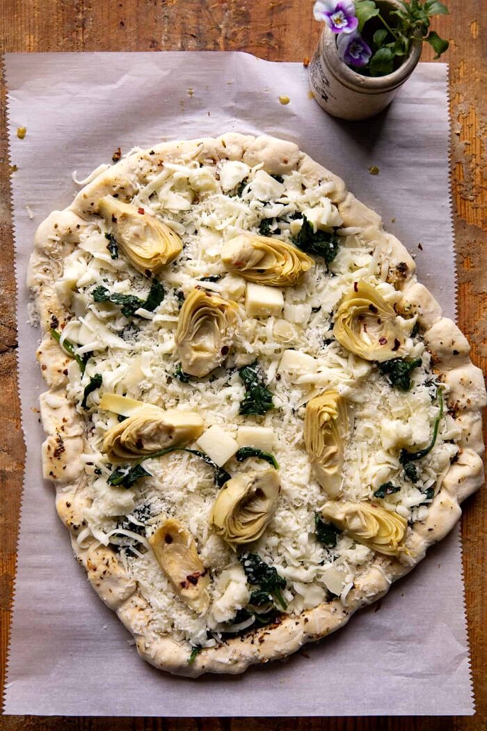 Spinach and Artichoke Pizza with Cheesy Bread Crust | halfbakedharvest.com