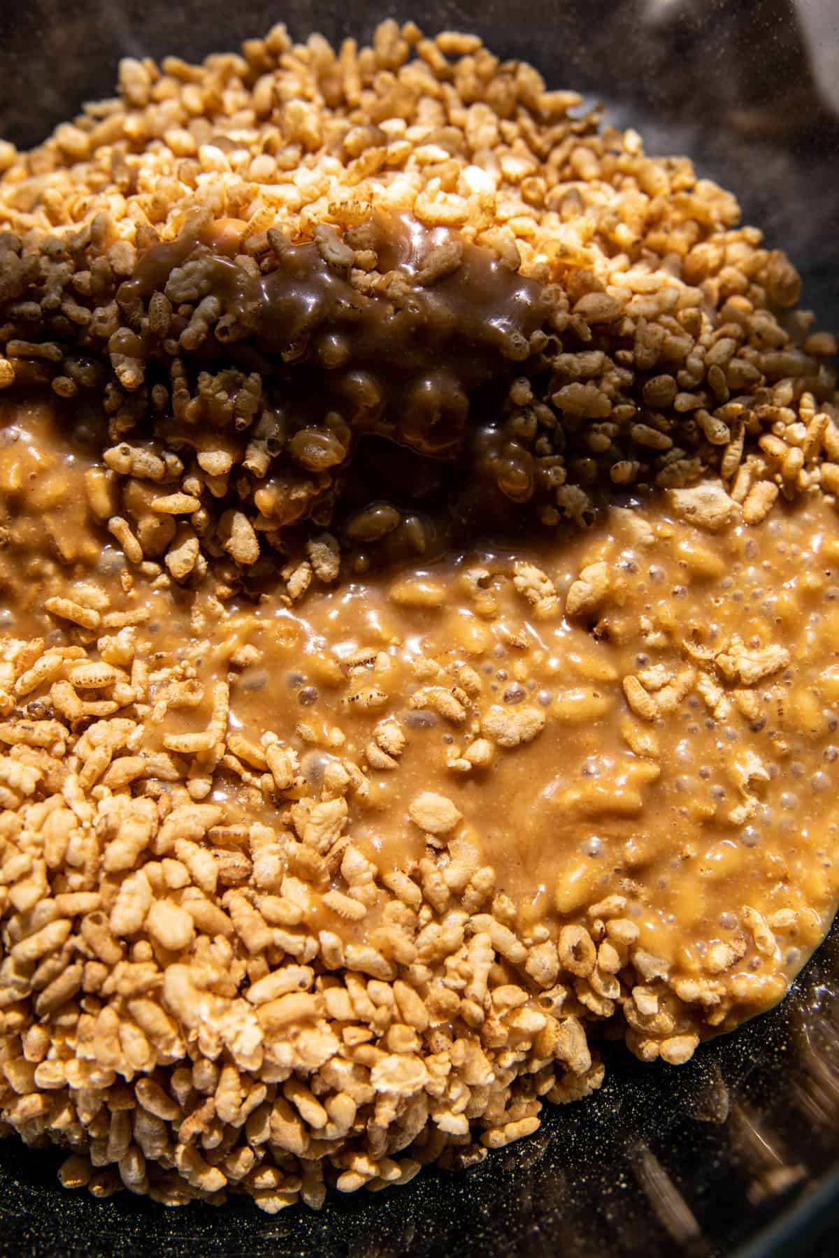 brown rice krispies and peanut butter in mixing bowl 