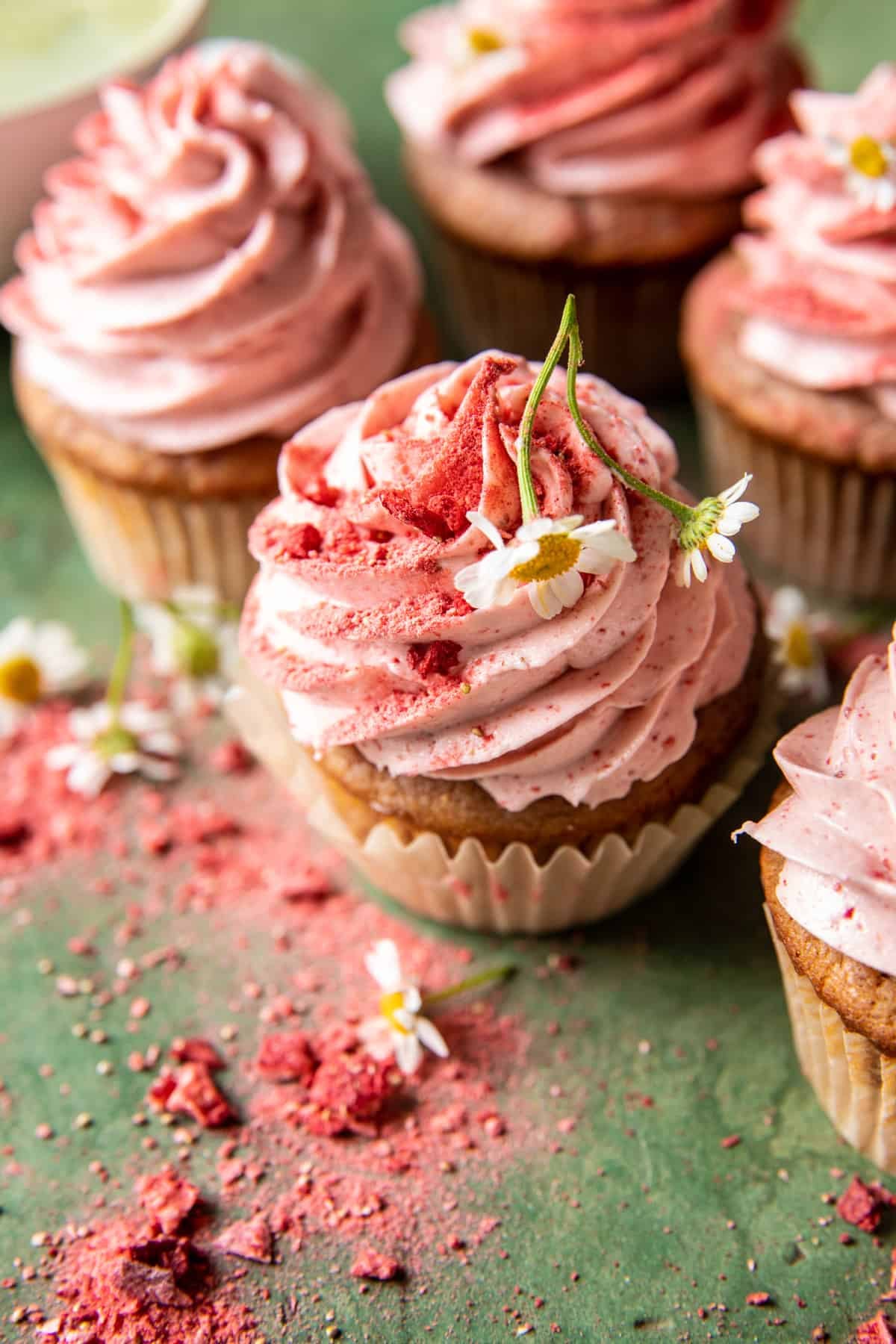 overhead photo of strawberry cupcakes on table 