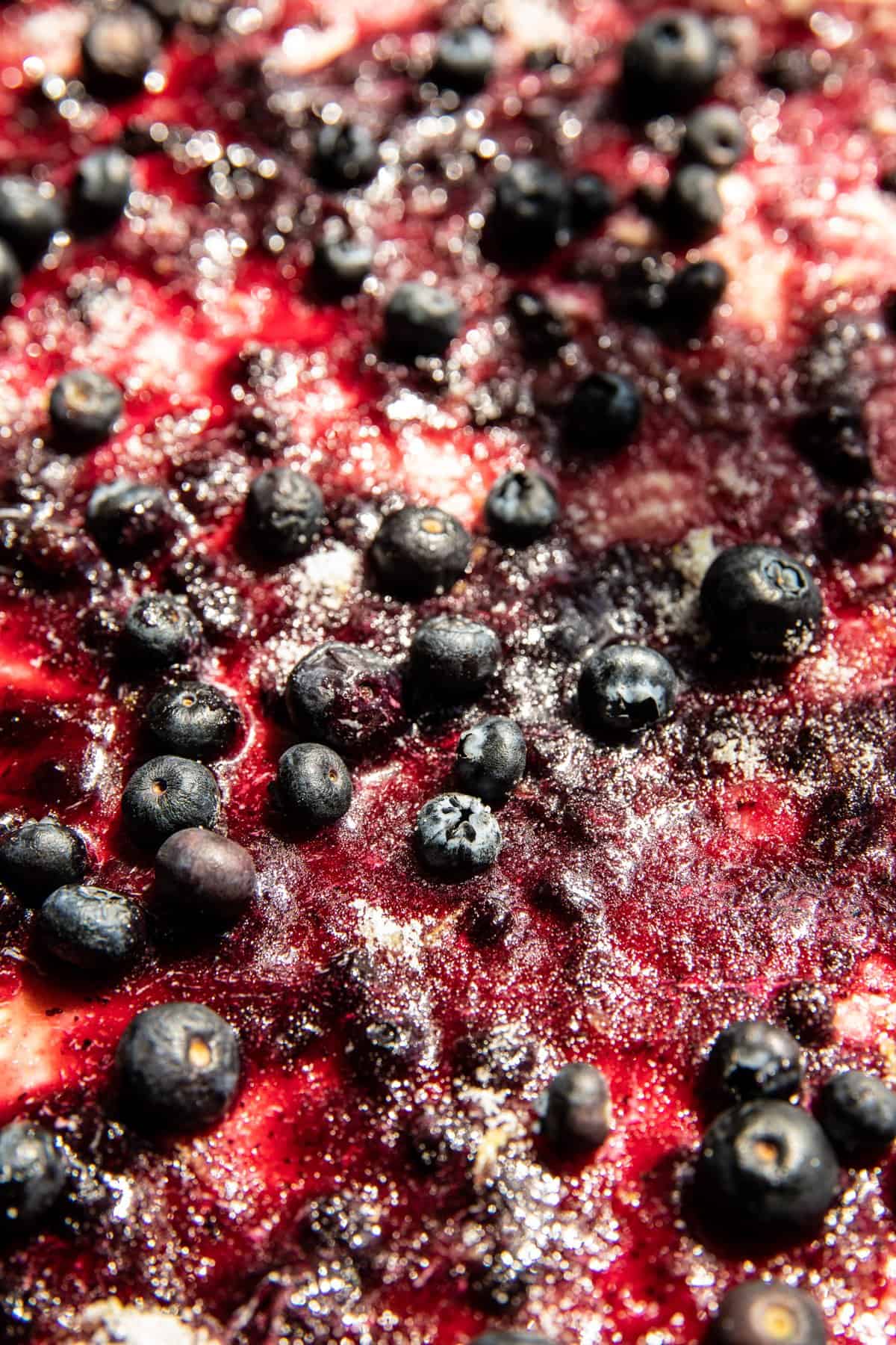 blueberry jam on dough before rolling 