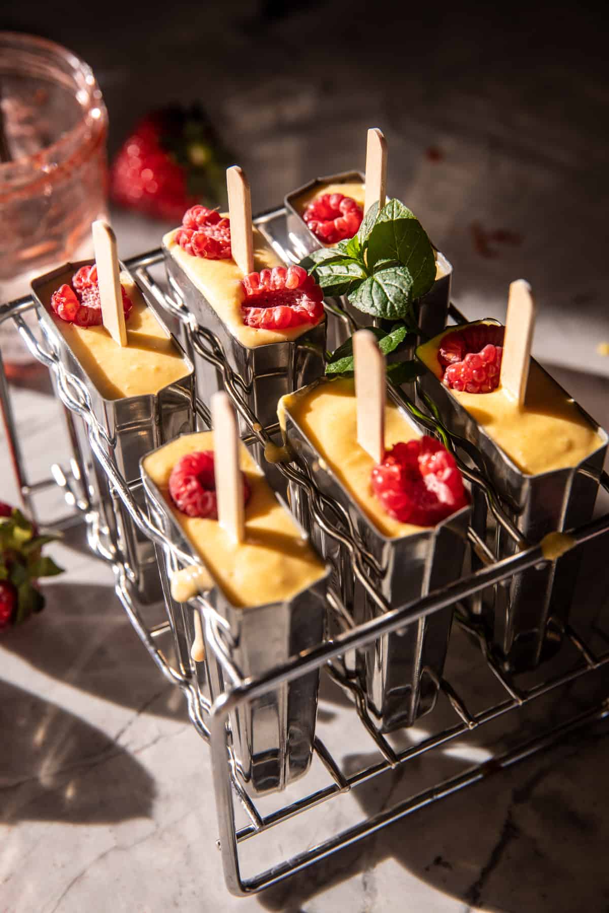 Creamy Strawberry Mango Popsicles | halfbakedharvest.com
