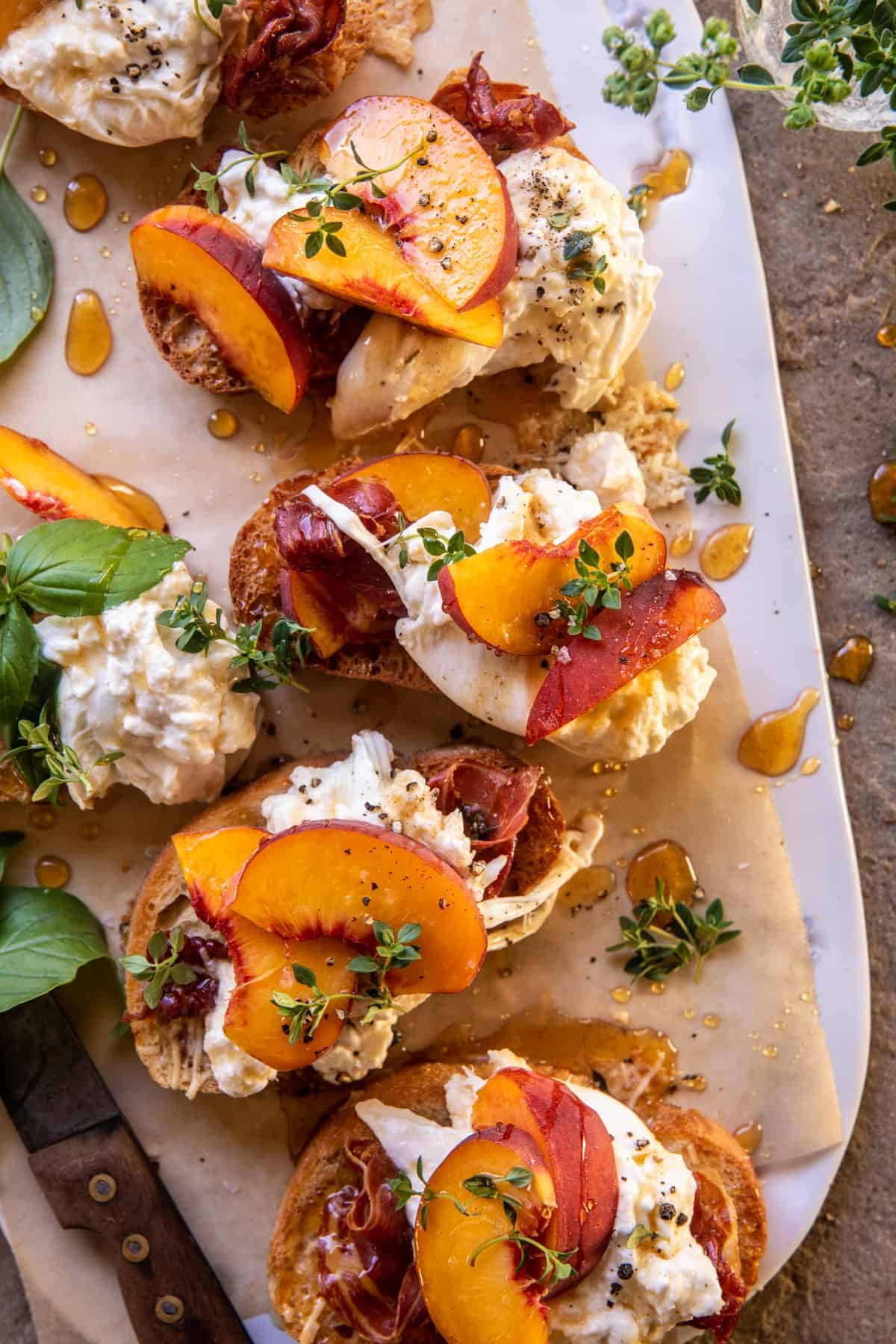 Peach Burrata Parmesan Crostini with Hot Honey | halfbakedharvest.com