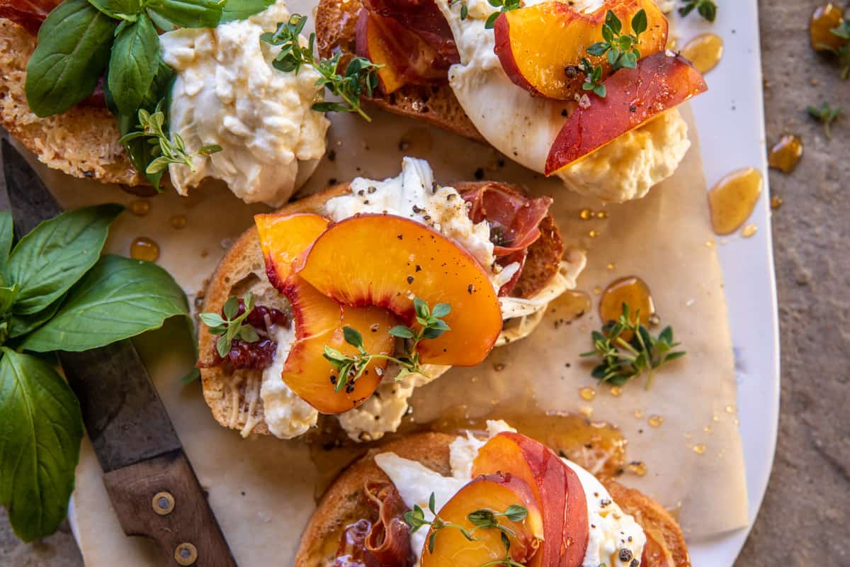 Peach Burrata Parmesan Crostini with Hot Honey | halfbakedharvest.com